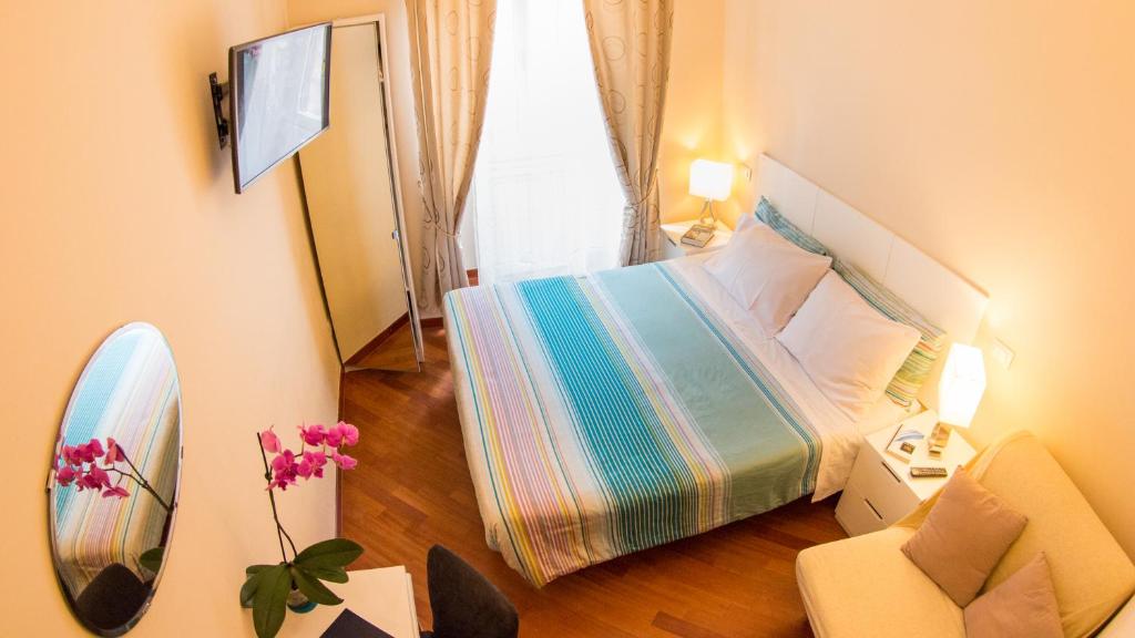Postel nebo postele na pokoji v ubytování Hotel Martino Ai Monti
