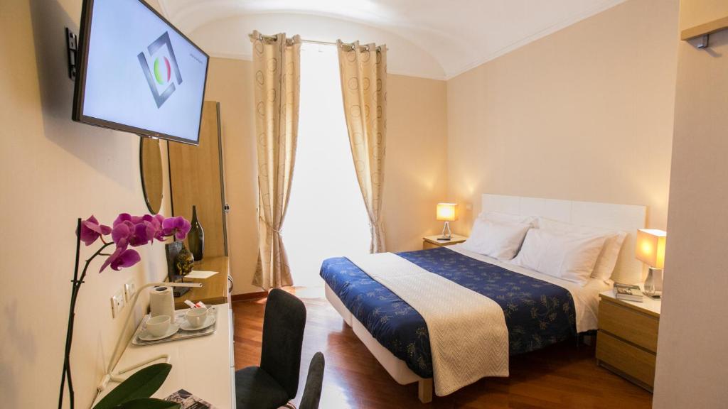Postel nebo postele na pokoji v ubytování Hotel Martino Ai Monti