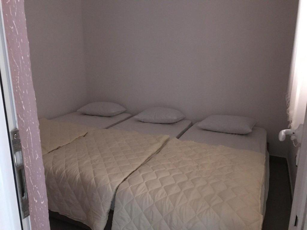 Postel nebo postele na pokoji v ubytování Vip Apartmani Canj