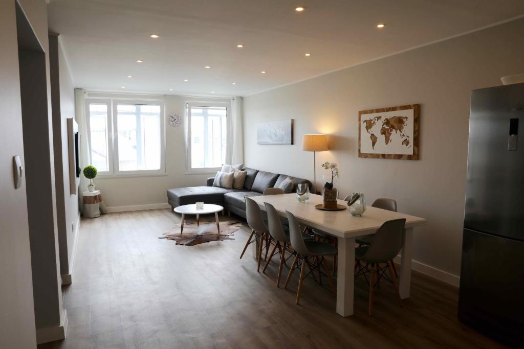 a living room with a table and a couch at Swakopmund Pearl in Swakopmund