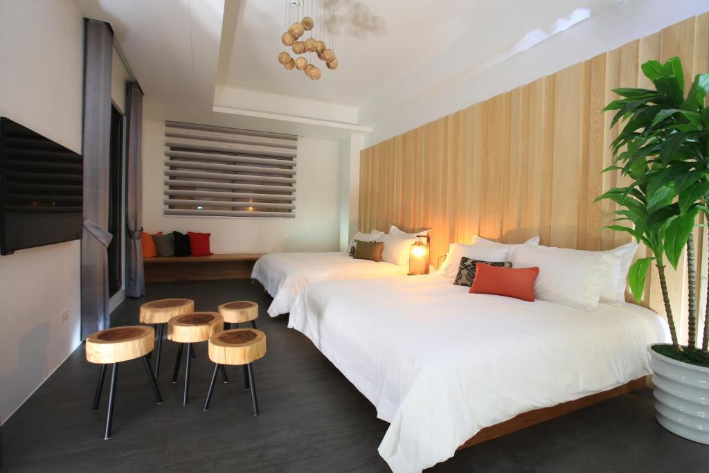 Postel nebo postele na pokoji v ubytování Qi Li Xiang Homestay