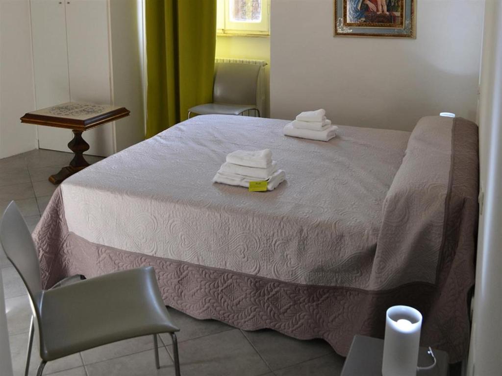 Łóżko lub łóżka w pokoju w obiekcie B&B freemocco