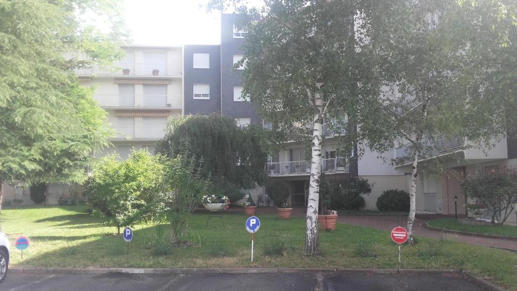 an apartment building with signs in front of it at L&#39;appartement du Haut Plessis in Blois