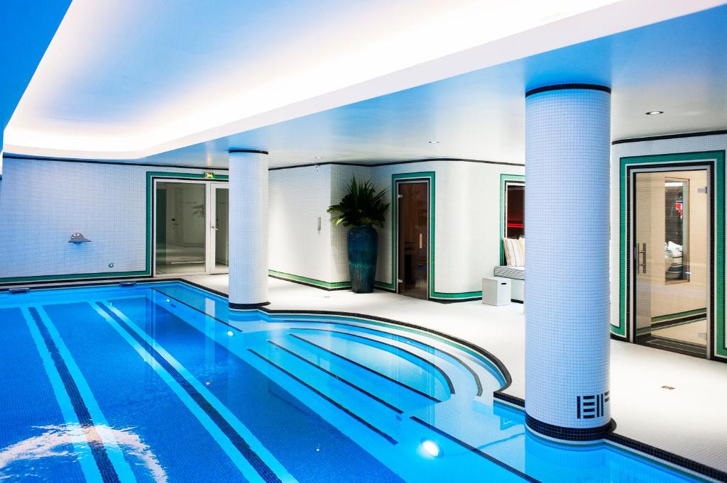 a swimming pool in a house at Hotel Eiffel Blomet in Paris