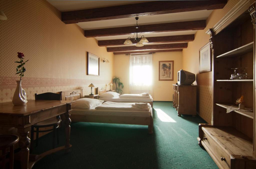 Postel nebo postele na pokoji v ubytování Hotel & Caffe Silesia