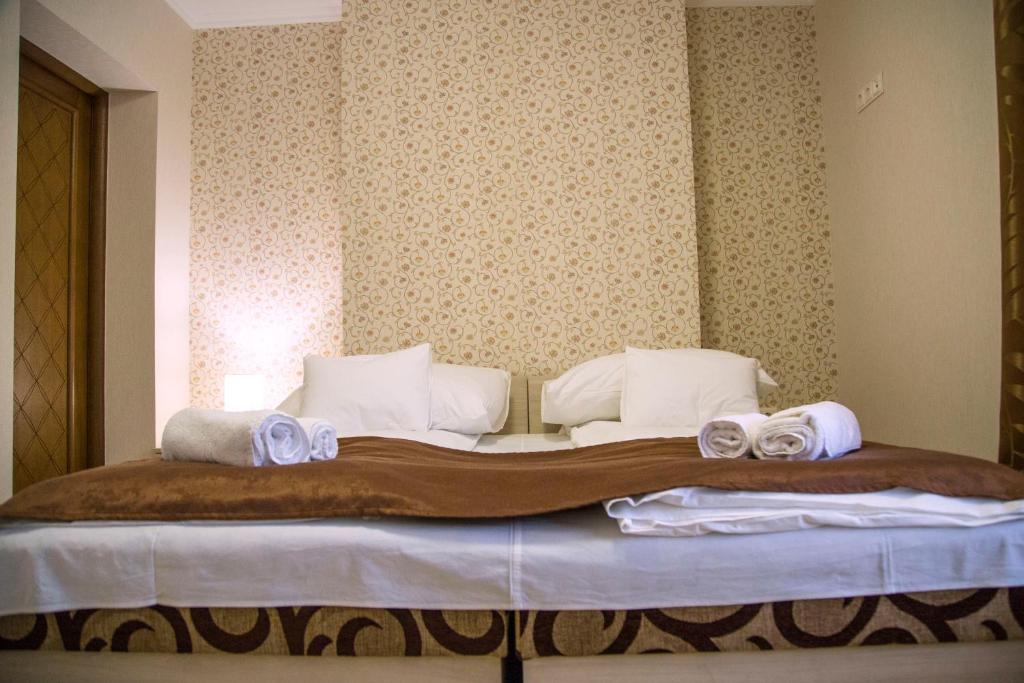 Postel nebo postele na pokoji v ubytování Mirage Hotel