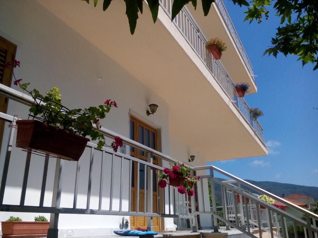 a balcony of a house with flowers on it at St Paul and Peter's House in Asprovalta
