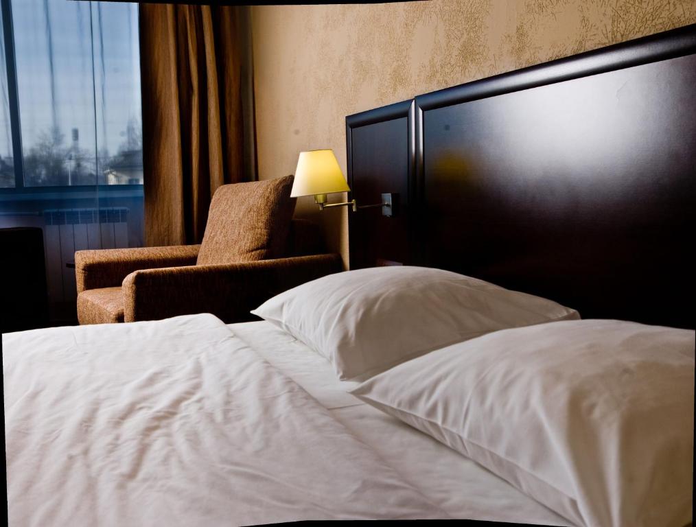 
Кровать или кровати в номере Отель Атриум
