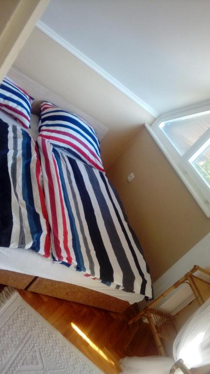 Posteľ alebo postele v izbe v ubytovaní Horváth Apartmanház
