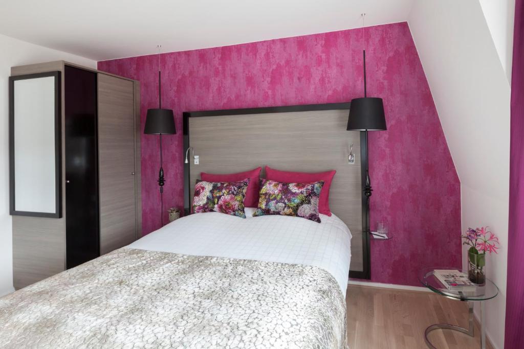 Postel nebo postele na pokoji v ubytování Andersen Boutique Hotel