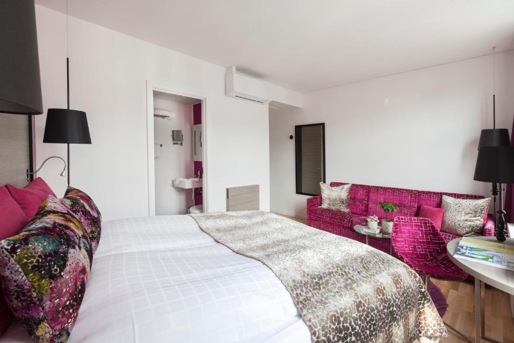 Postel nebo postele na pokoji v ubytování Andersen Boutique Hotel