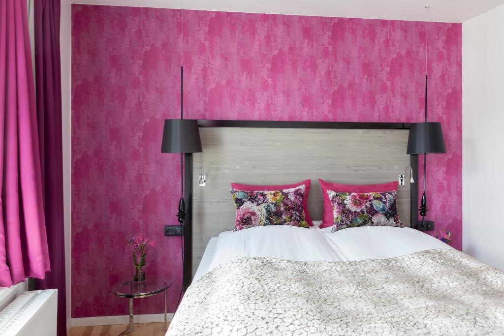 Postel nebo postele na pokoji v ubytování Andersen Boutique Hotel