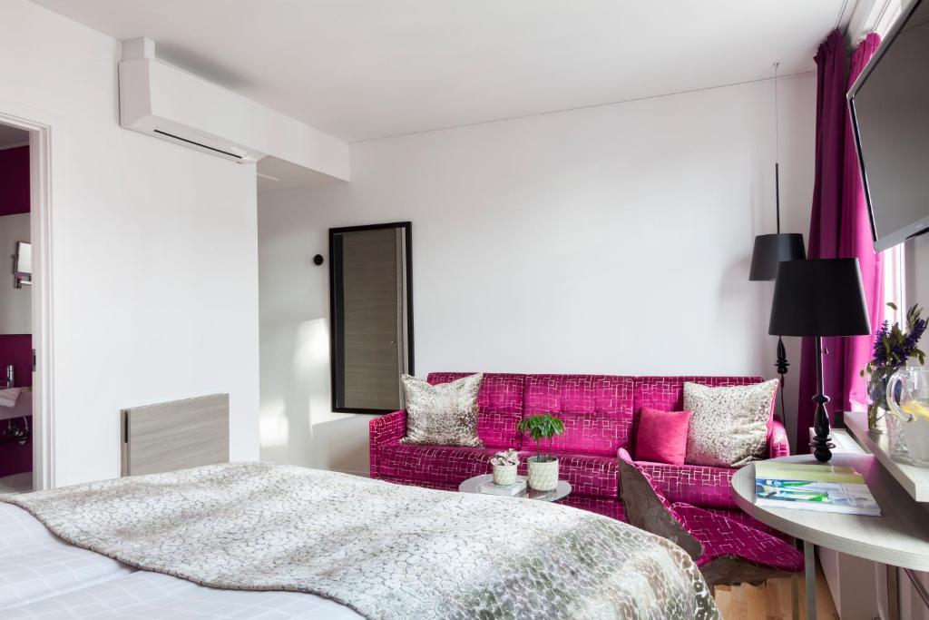 Postel nebo postele na pokoji v ubytování Andersen Boutique Hotel