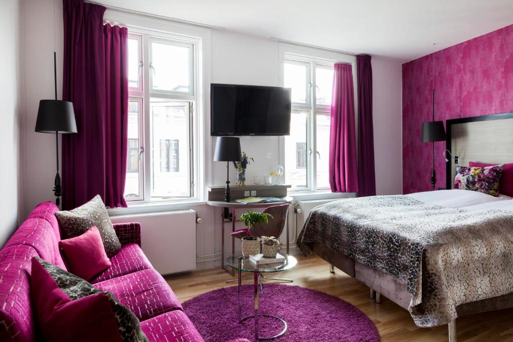 Postel nebo postele na pokoji v ubytování Andersen Boutique Hotel