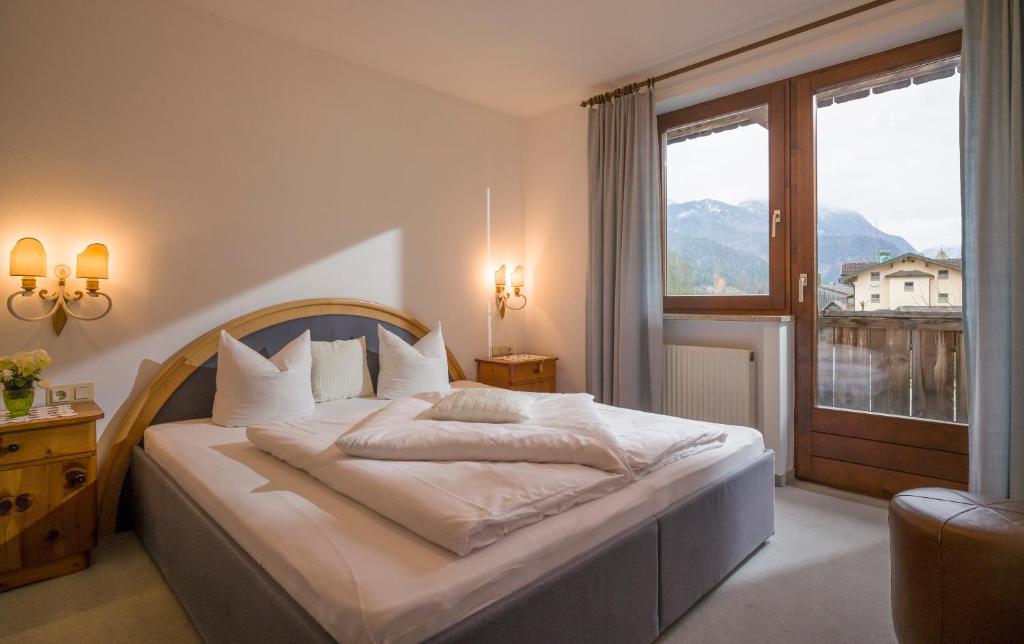 Postel nebo postele na pokoji v ubytování Das Landhaus am See