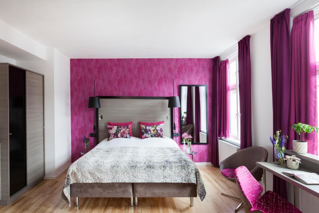 Postel nebo postele na pokoji v ubytování Andersen Boutique Hotel