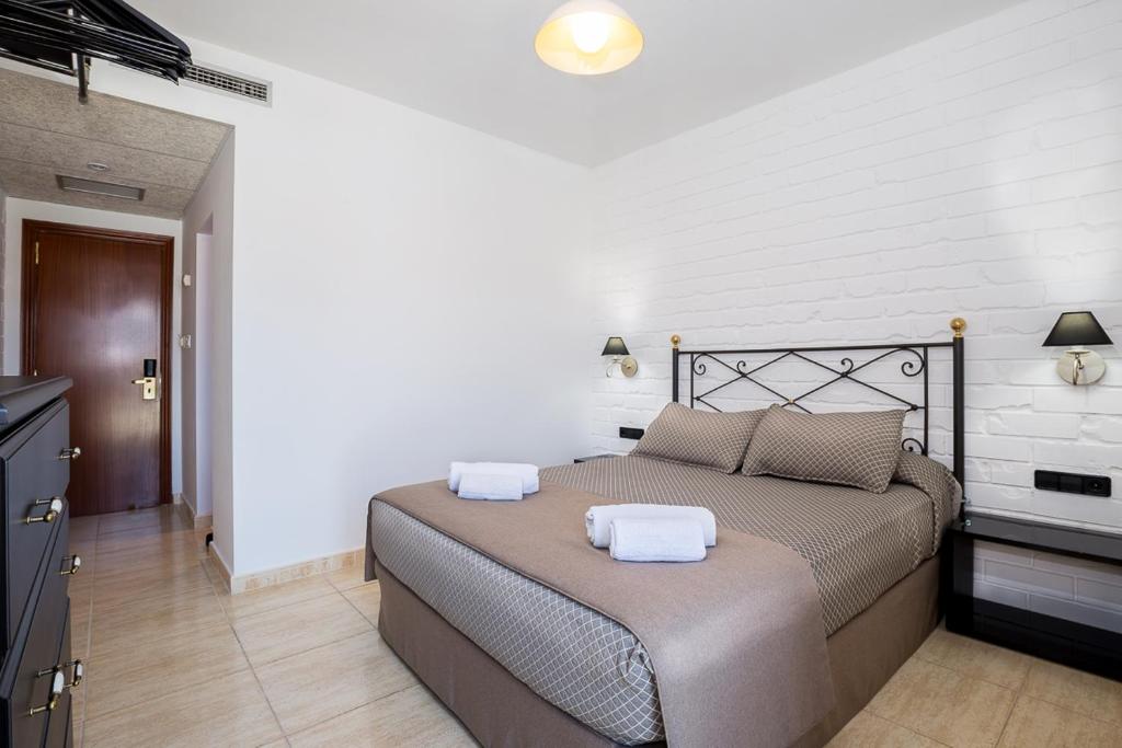 Postel nebo postele na pokoji v ubytování Hotel Montmar