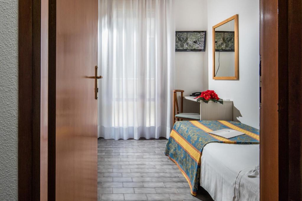 Postel nebo postele na pokoji v ubytování Hotel Bettina