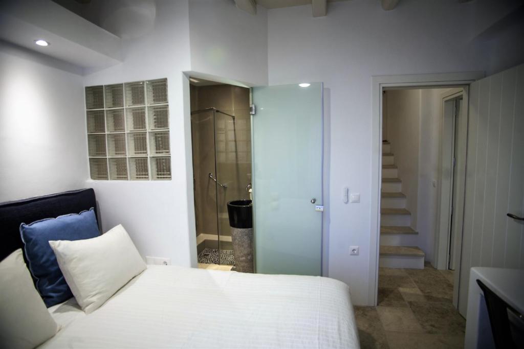 Posteľ alebo postele v izbe v ubytovaní Kalypso Villas