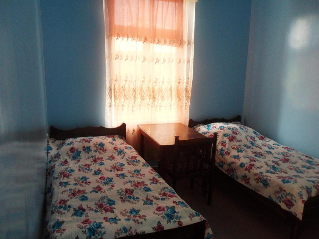 Postel nebo postele na pokoji v ubytování Guest House Nika