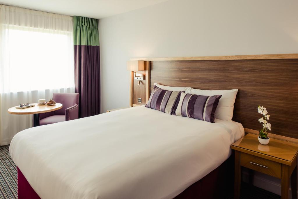Postel nebo postele na pokoji v ubytování Aspect Hotel Park West