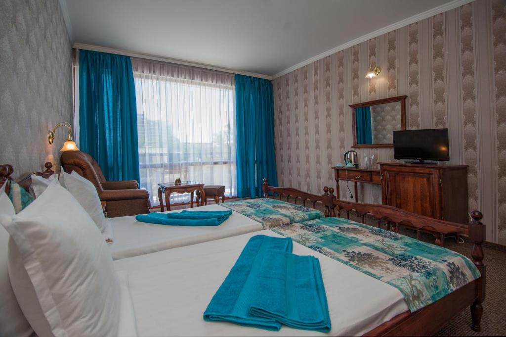Postel nebo postele na pokoji v ubytování Mercury Hotel-Premium All Inclusive