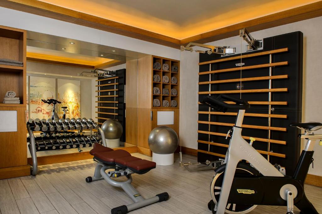 a fitness room with a gym with a treadmill and a gym at Five Seas by Inwood Hotels in Cannes