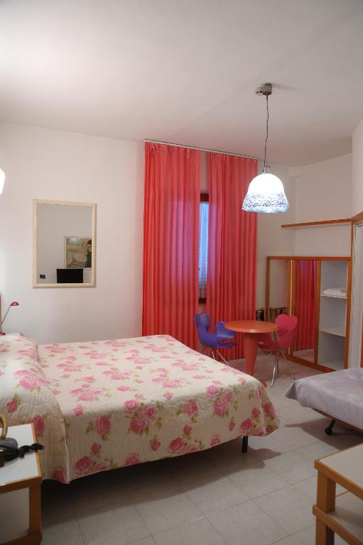 Postel nebo postele na pokoji v ubytování Hotel Il Falchetto