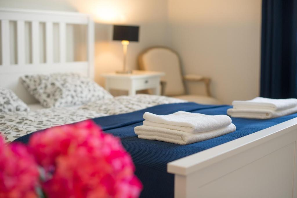 Posteľ alebo postele v izbe v ubytovaní Bródy Apartman
