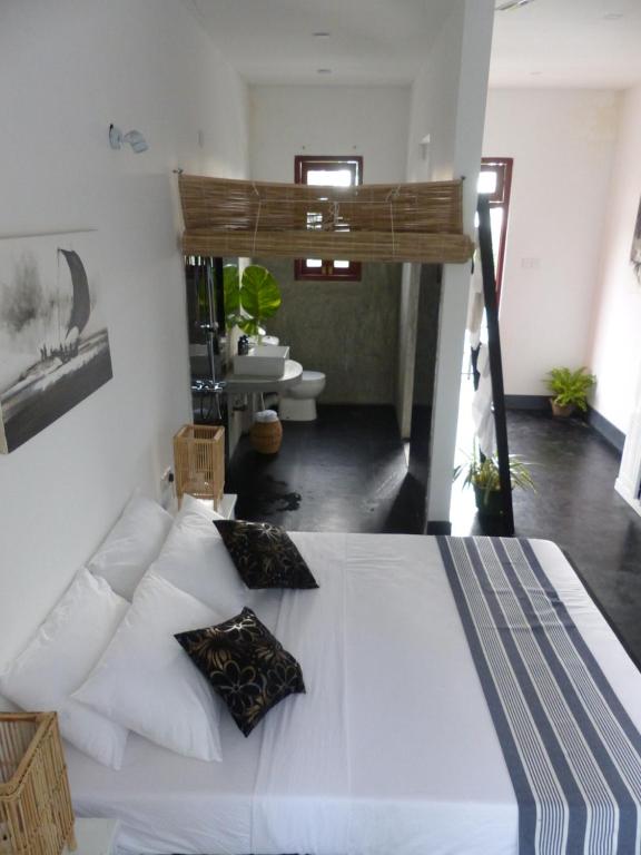Postel nebo postele na pokoji v ubytování Lake House Hikka