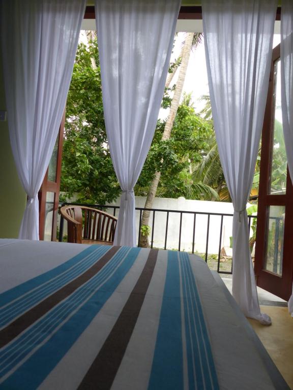 Postel nebo postele na pokoji v ubytování Lake House Hikka
