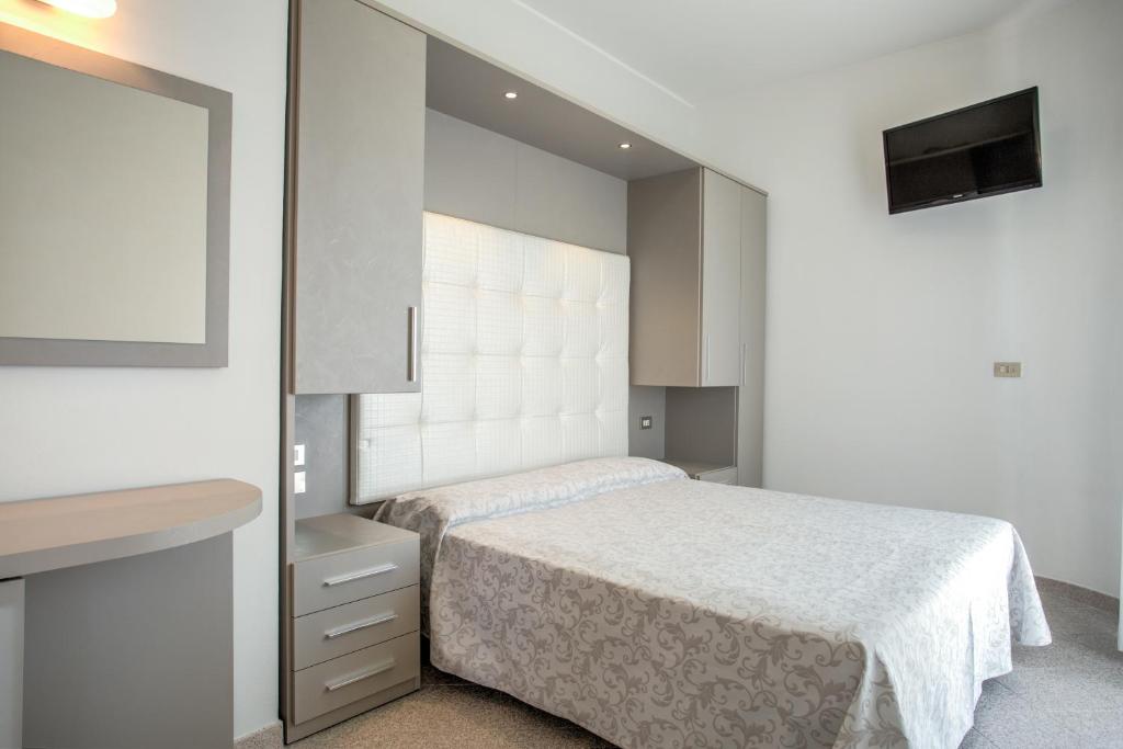 Postel nebo postele na pokoji v ubytování Hotel Olympia