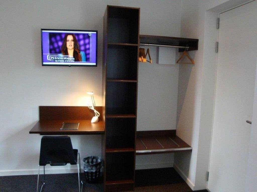 TV a/nebo společenská místnost v ubytování Agerbæk Hotel