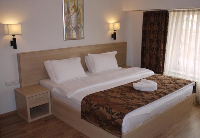 Postel nebo postele na pokoji v ubytování Hotel Pinocchio