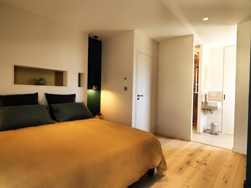 Ένα ή περισσότερα κρεβάτια σε δωμάτιο στο Les Loges En Provence "Le 1911"