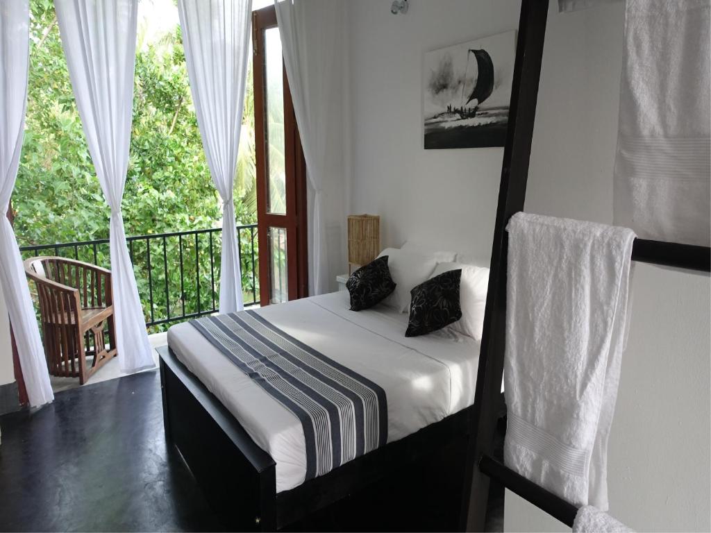 Postel nebo postele na pokoji v ubytování Lake House Hikka