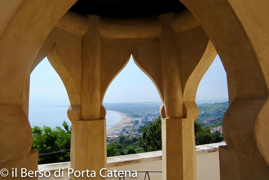 a view of the ocean from a window of a building at Il Bersó di Porta Catena in Vasto