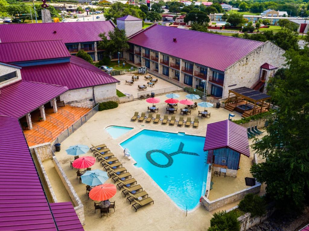 an aerial view of a hotel with a pool and umbrellas at Y O Ranch Hotel and Conference Center in Kerrville
