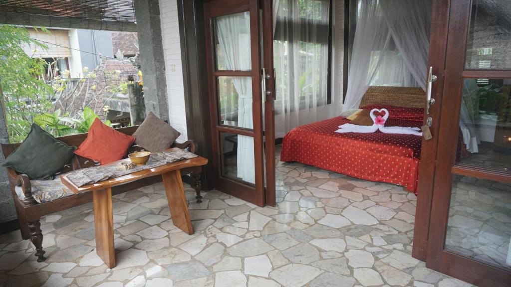Postel nebo postele na pokoji v ubytování Puri Cantik