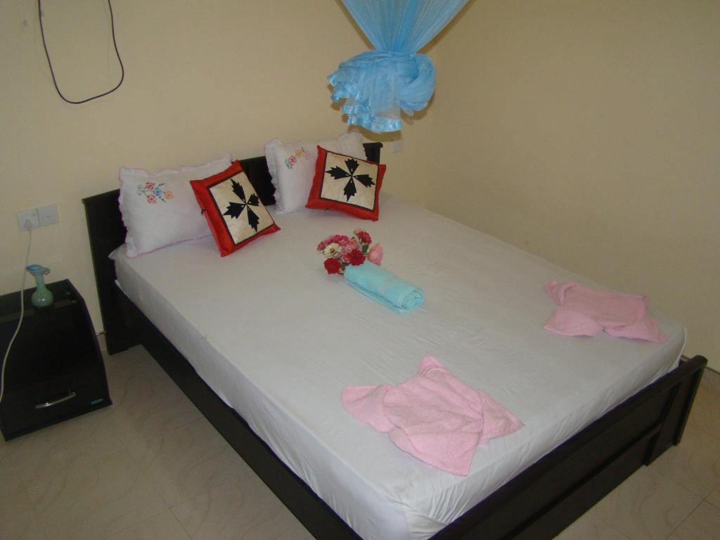 Postel nebo postele na pokoji v ubytování Serenity Homestay