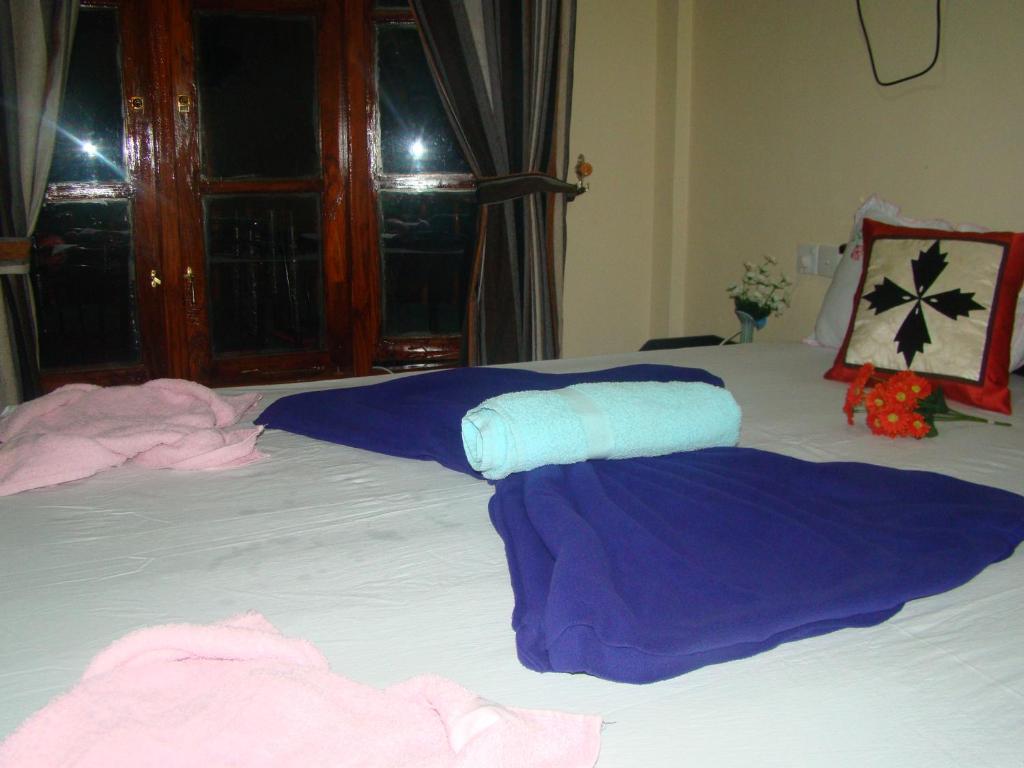 Postel nebo postele na pokoji v ubytování Serenity Homestay
