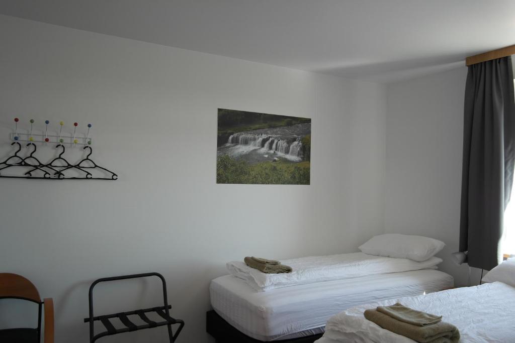 Postel nebo postele na pokoji v ubytování Eidavellir Apartments and Rooms