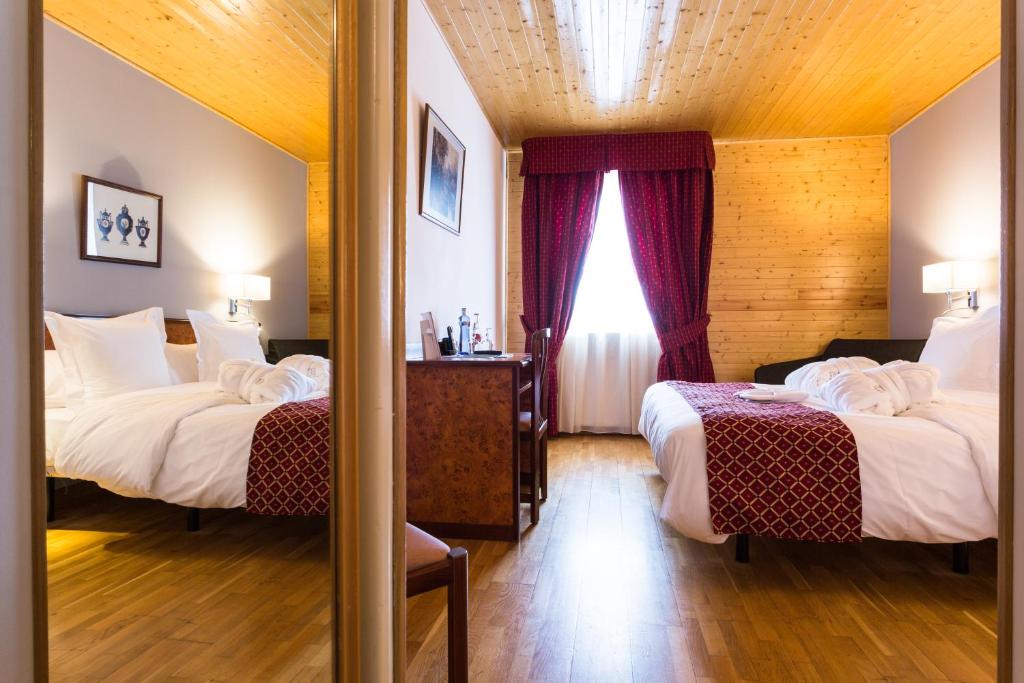 Postel nebo postele na pokoji v ubytování Hotel & SPA Llop Gris