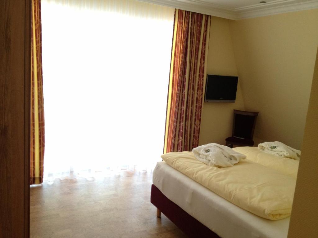 Postel nebo postele na pokoji v ubytování Wald-Hotel Heppe