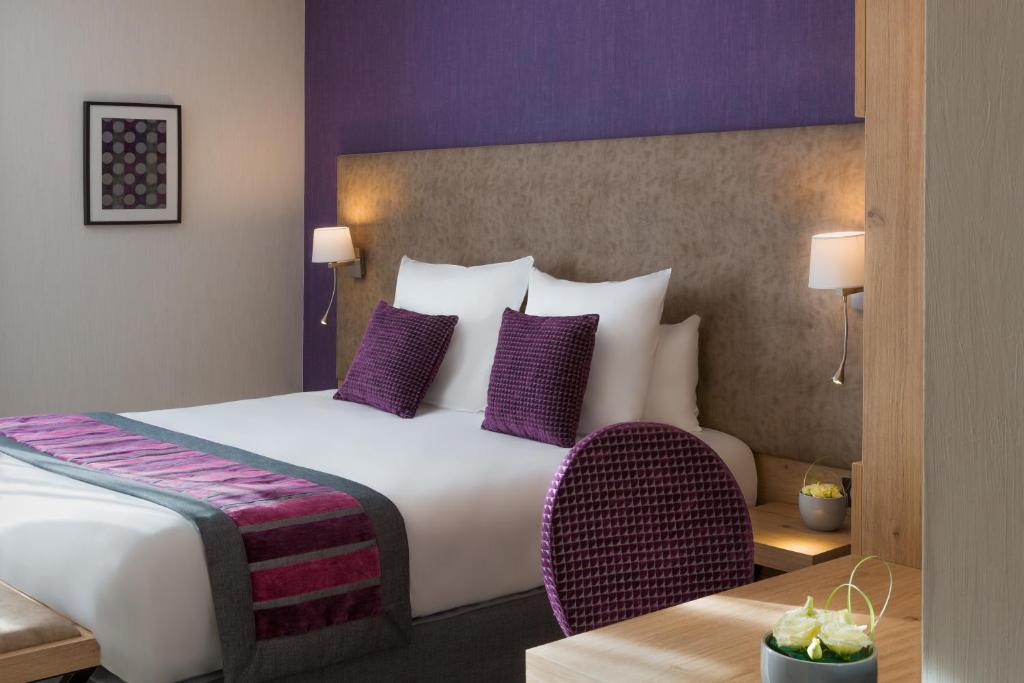 Postel nebo postele na pokoji v ubytování Hôtel Le Rive Droite & SPA