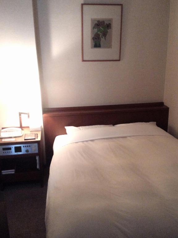 Postel nebo postele na pokoji v ubytování Hotel Danrokan