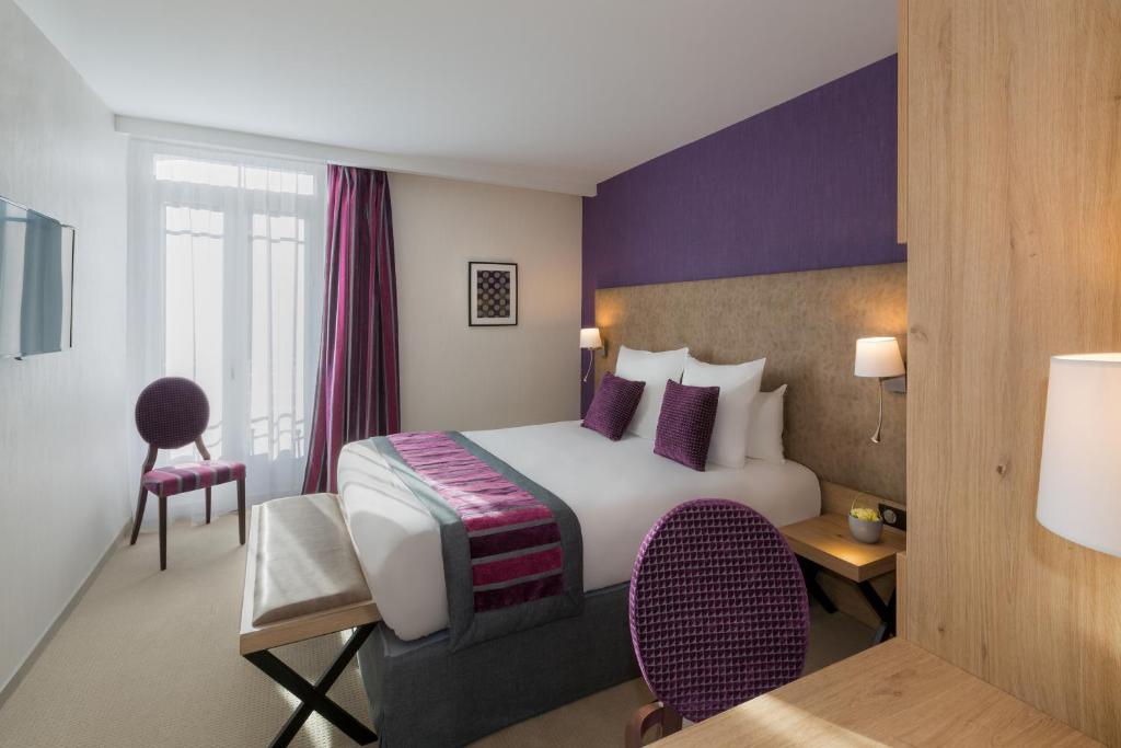 Postel nebo postele na pokoji v ubytování Hôtel Le Rive Droite & SPA