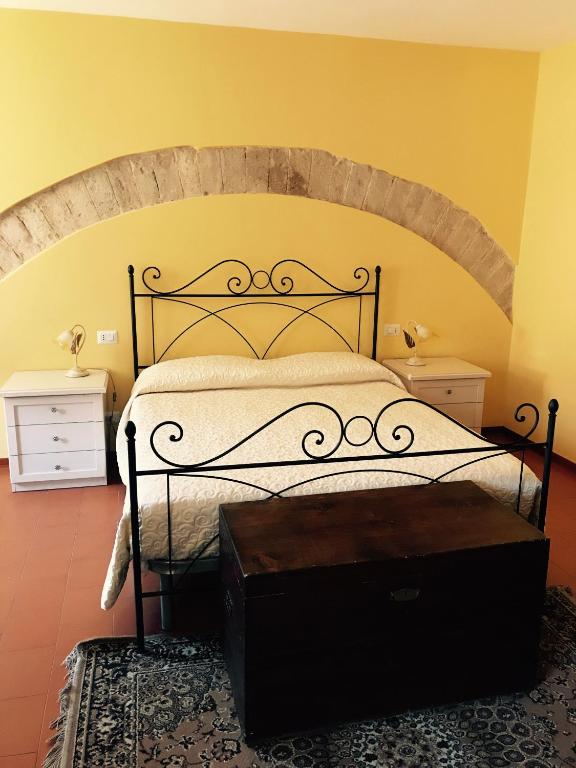 Postel nebo postele na pokoji v ubytování B&B La Dimora del Capitano