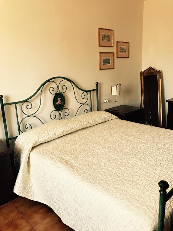 Postel nebo postele na pokoji v ubytování B&B La Dimora del Capitano