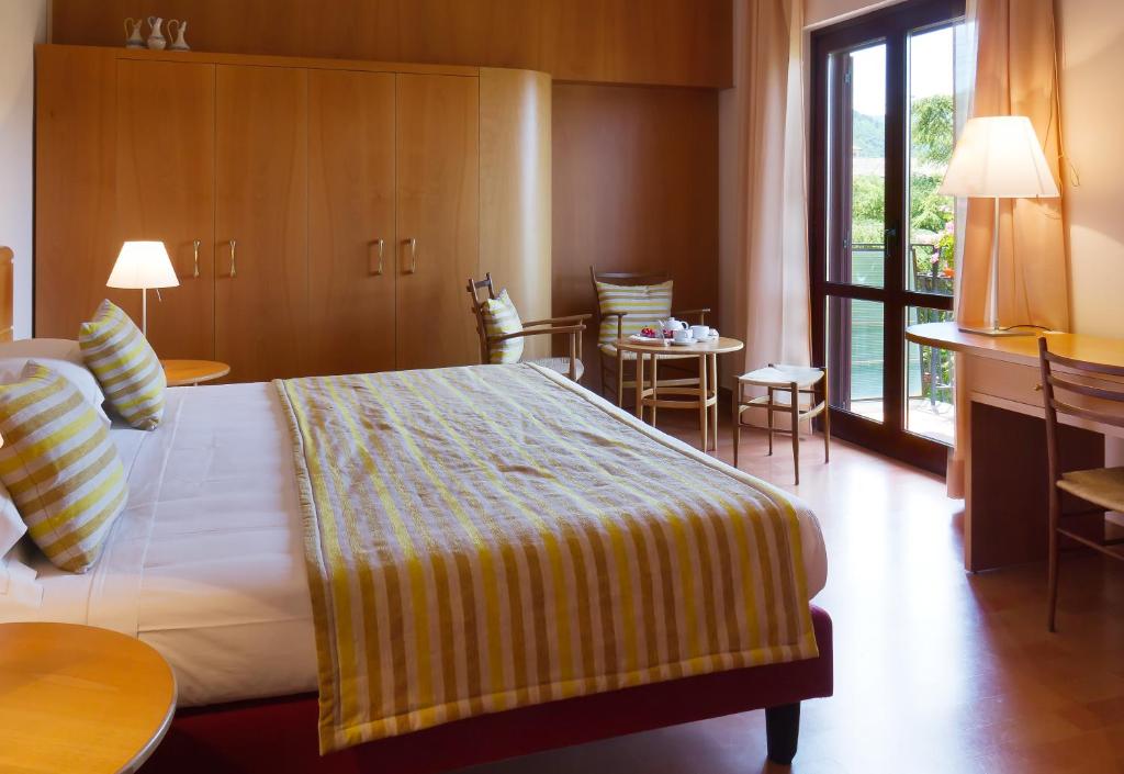Postel nebo postele na pokoji v ubytování Hotel dei Duchi